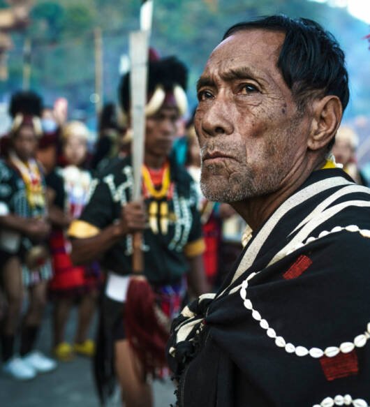 Nagaland tribal old leader, monitoring his people while performing.