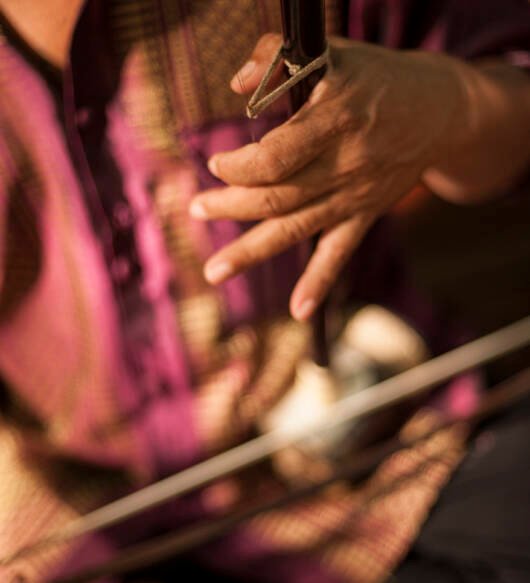 midsection-man-playing-musical-instrument
