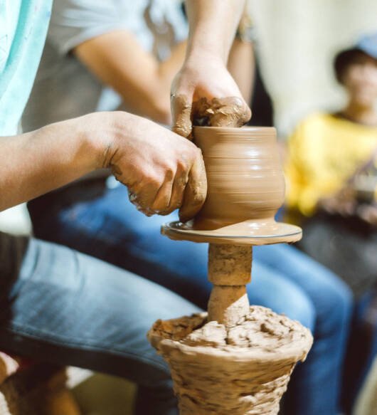 midsection-man-working-pottery-wheel