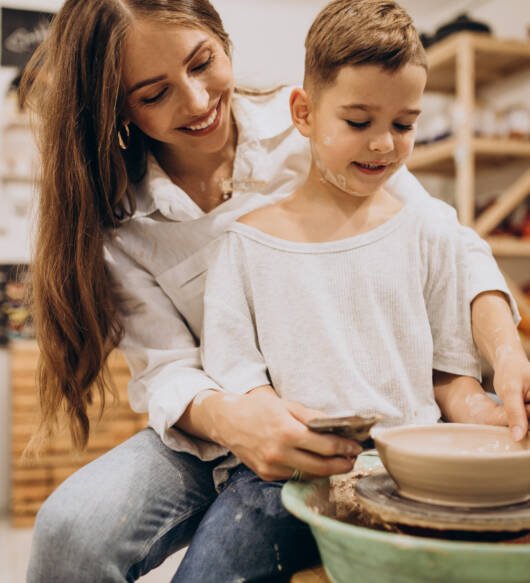 Mother with son at a pottery class