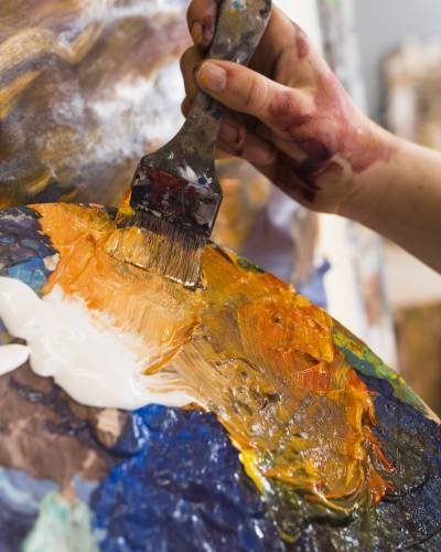 person-s-hand-painting-with-messy-paint-paintbrush person-s-hand-painting-with-messy-paint-paintbrush