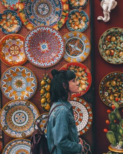 woman wearing blue denim jacket across plates